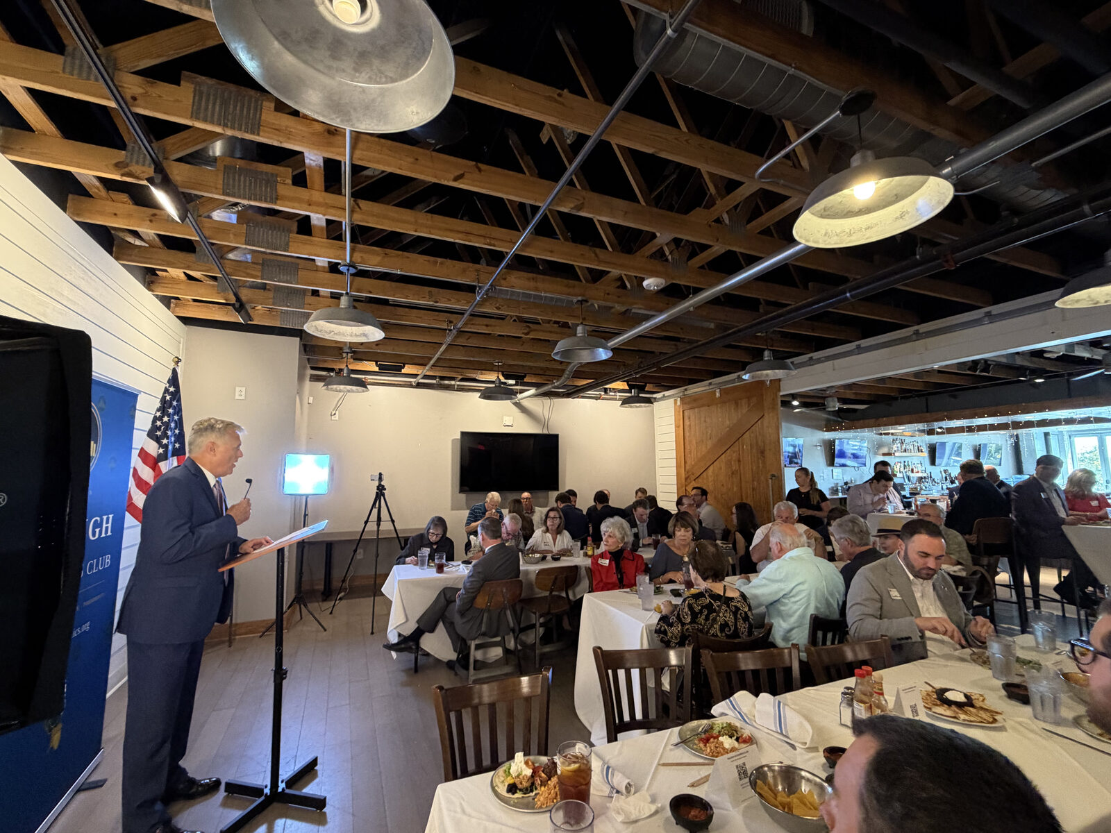 John Hood presenting, wide view